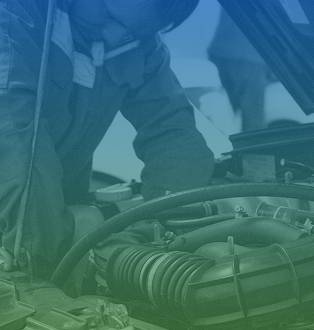 Professional mechanic inspecting engine